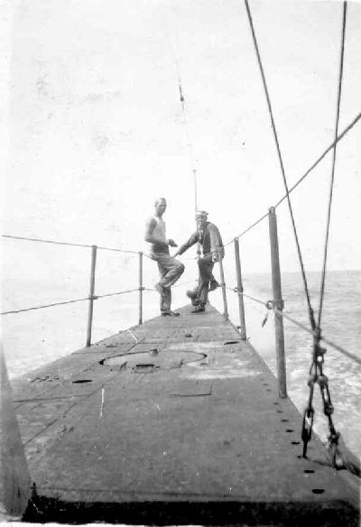 Crew relaxing on the stern while underway