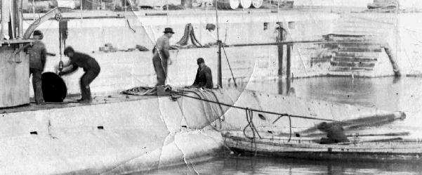 Workmen working on the F-3 while crew photo is being taken