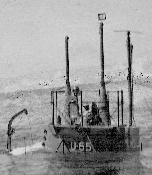 USS F-3 as the U-65 conning tower close-up. Man standing in hatch.