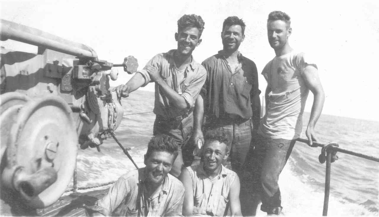 USS R-14 gun crew pose for the camera at sea