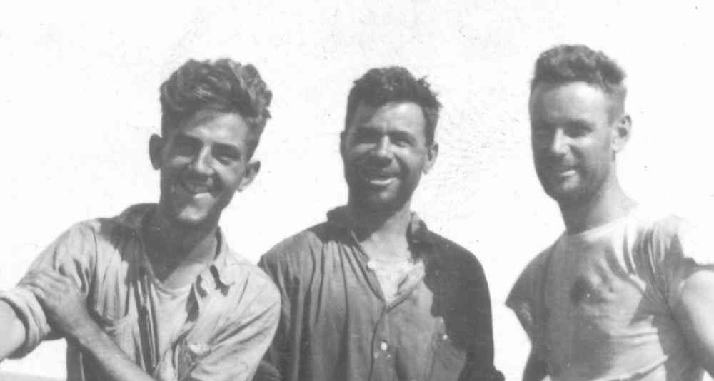 USS R-14 gun crew pose for the camera at sea