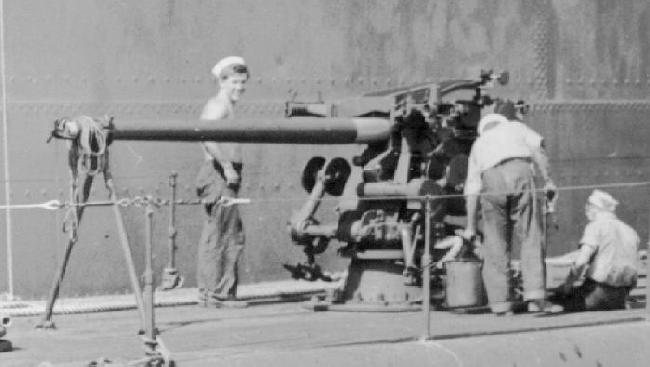 USS Plunger Gun Crew doing cleaning and maintinance