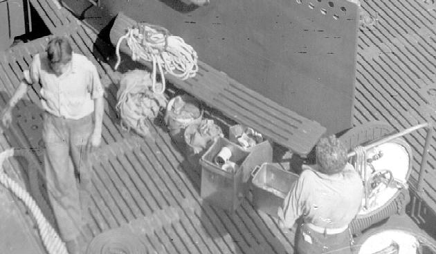 Men and gear on deck at aft of conning tower fairwater