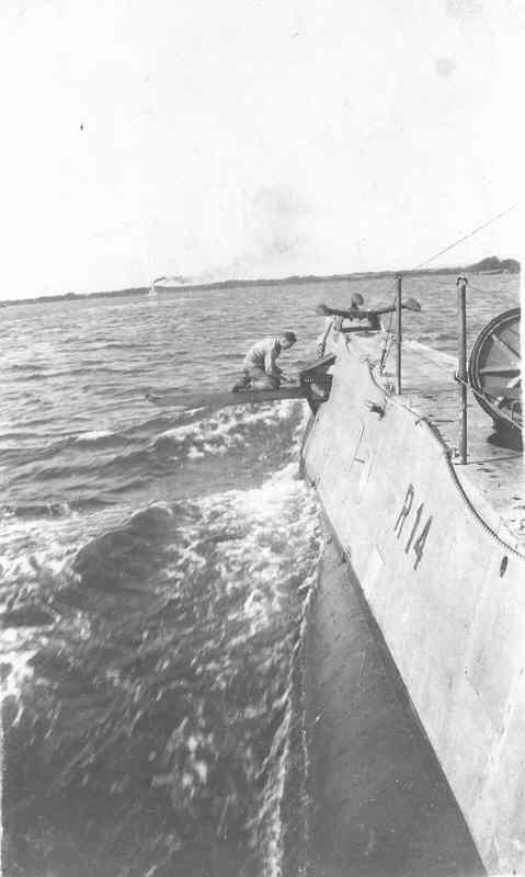 USS R-14 crewman working on bow planes