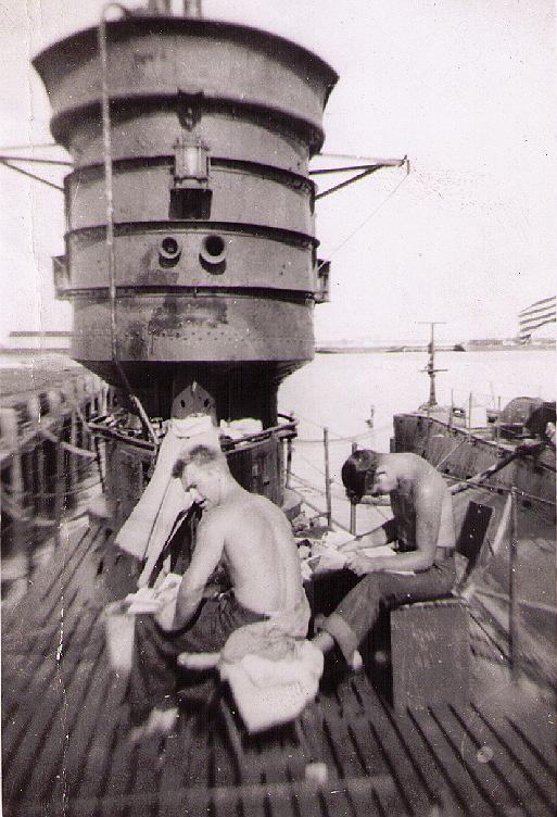 R-6 2 crew on deck r-10 alongside