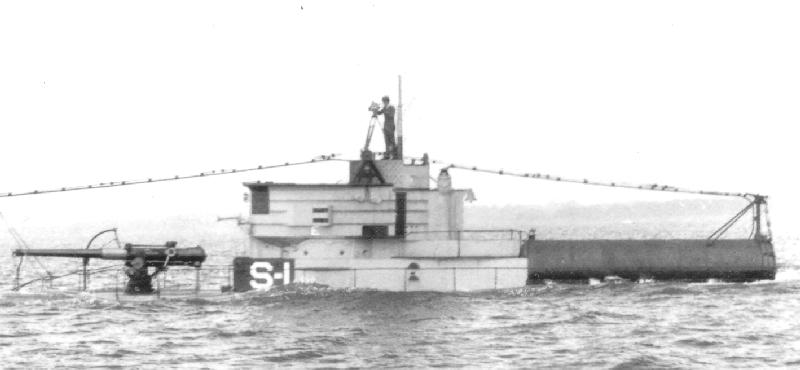 USS S-1 surfacing with cameraman on bridge