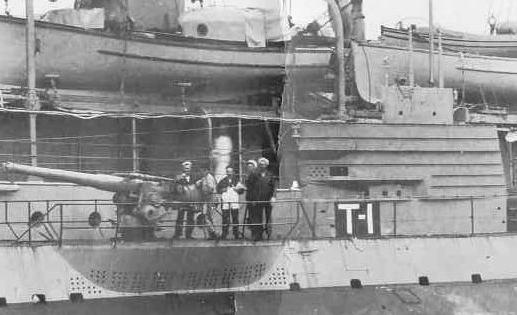 USS T-1 alongside the USS Fulton gun detail