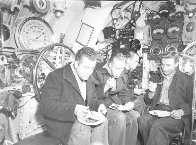 Crew eating in the Control room of the USS T-3